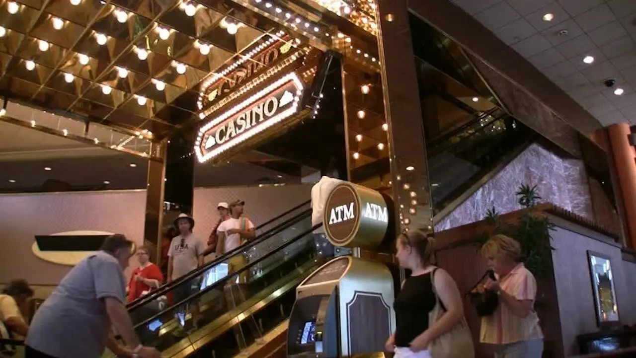 ATM machine sign in front of a casino