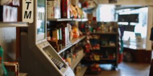 ATM machine inside a small local business American convenience store (bodega)